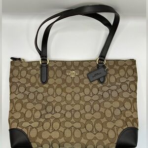 Coach purse two tone brown with gold hardware.